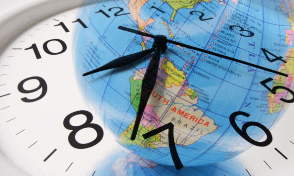 Image of a clock with a map of the world on it.